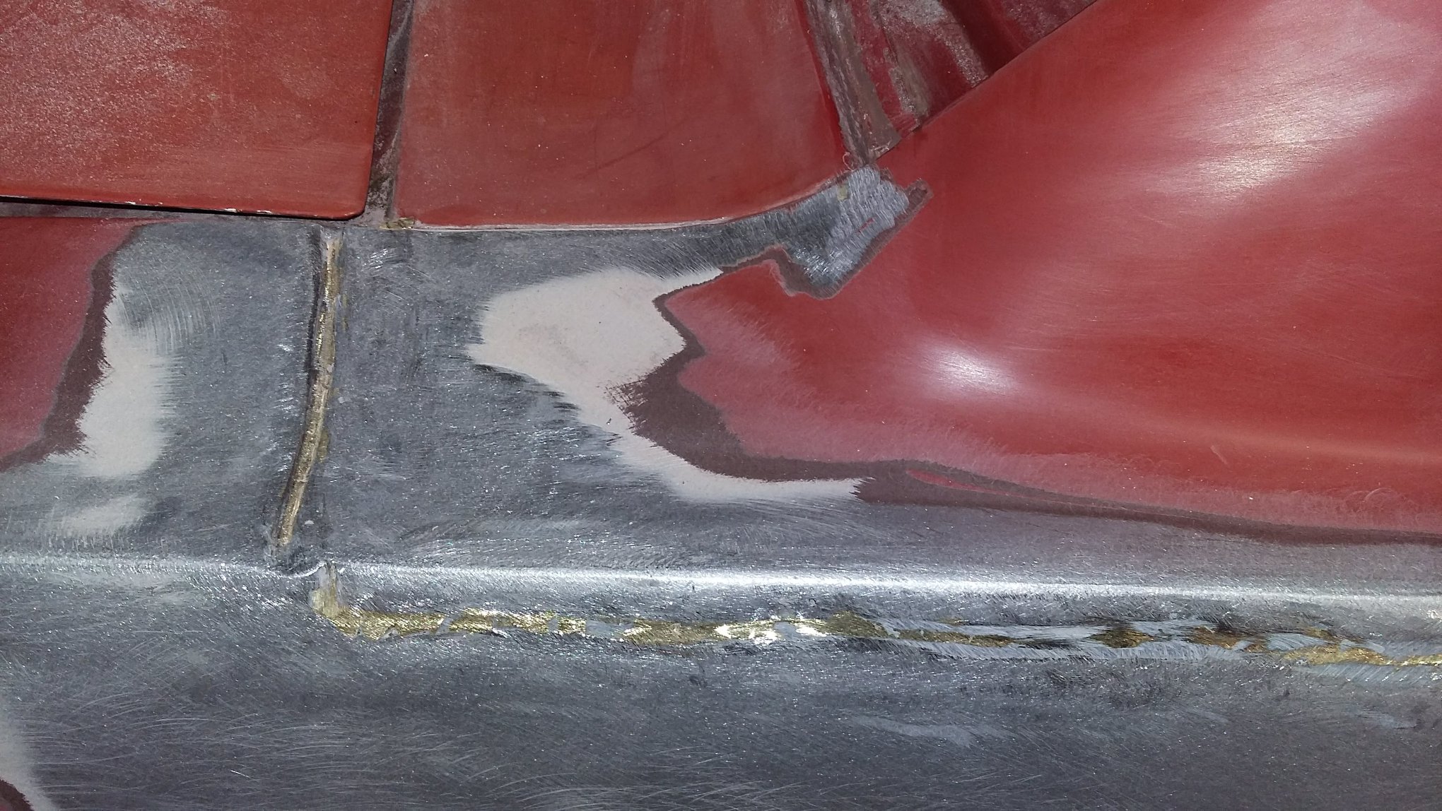 Prior crash damage weld seam close-up