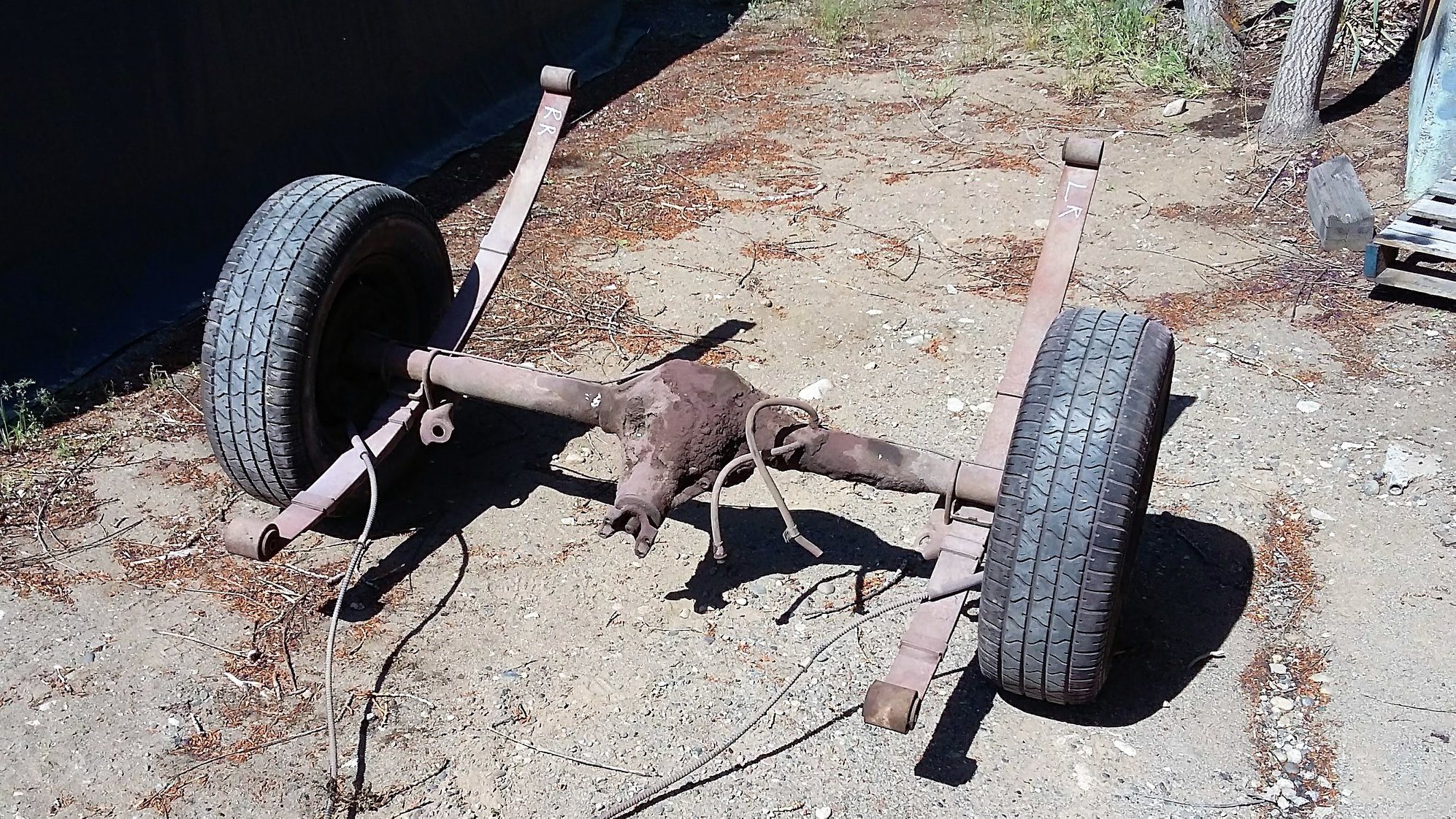 The rear axle before refurbishing. Notice the dark, oily, caked on dirt