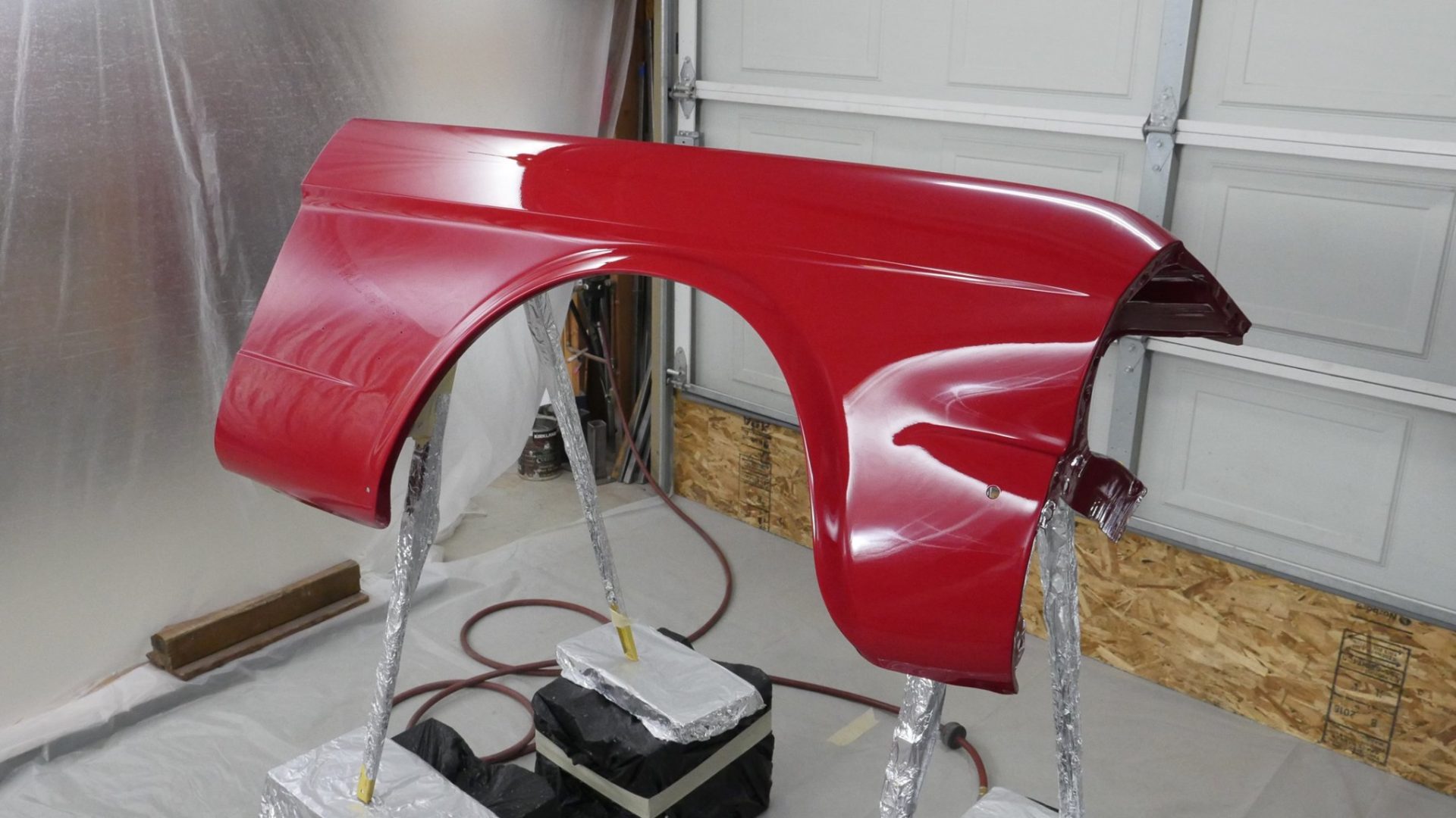 A fender with a fresh application of clear coat.