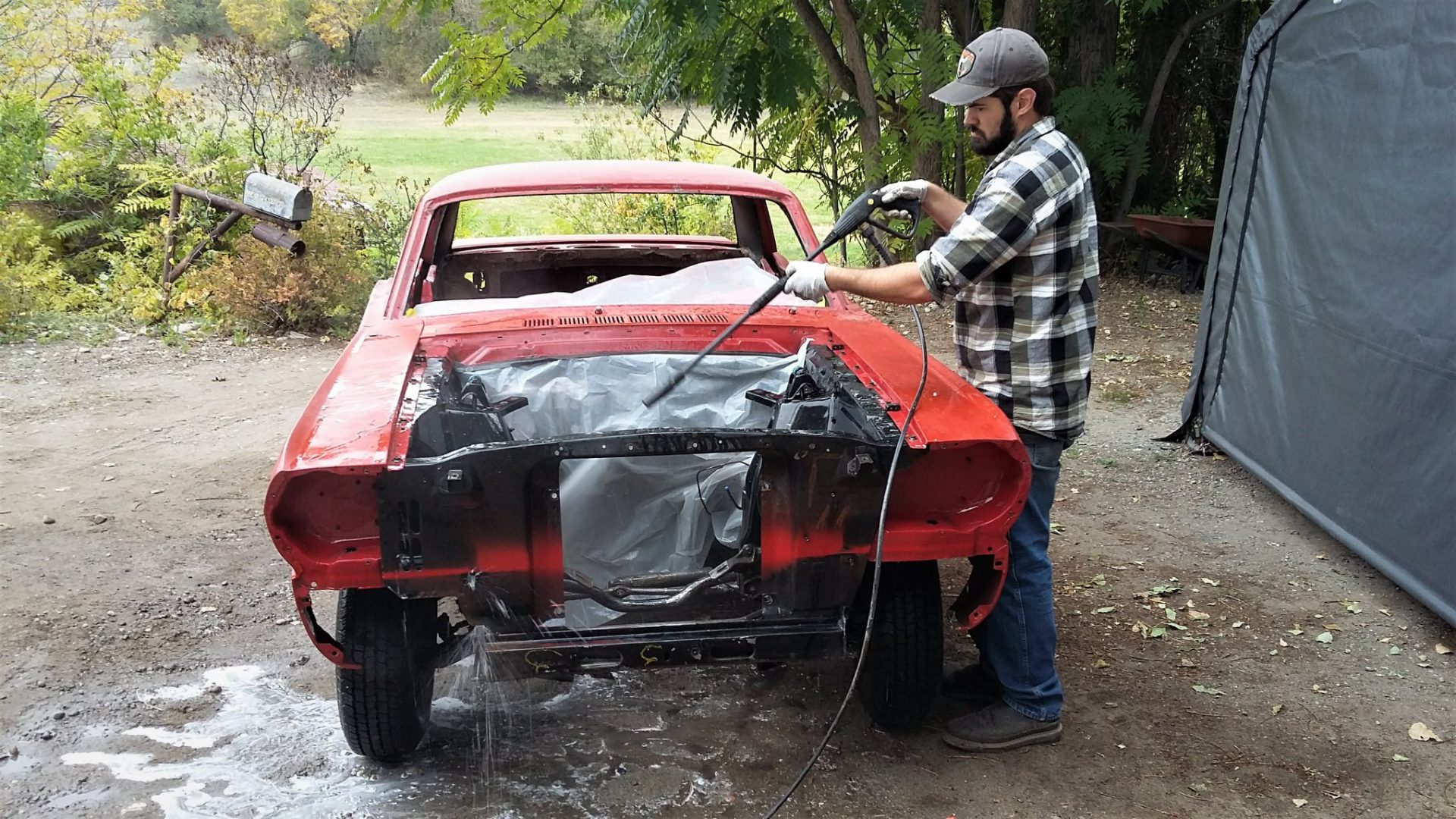 Pressure washing engine compartment