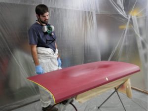 Austin contemplates adding fresh coats of clear to the sanded truck lid.