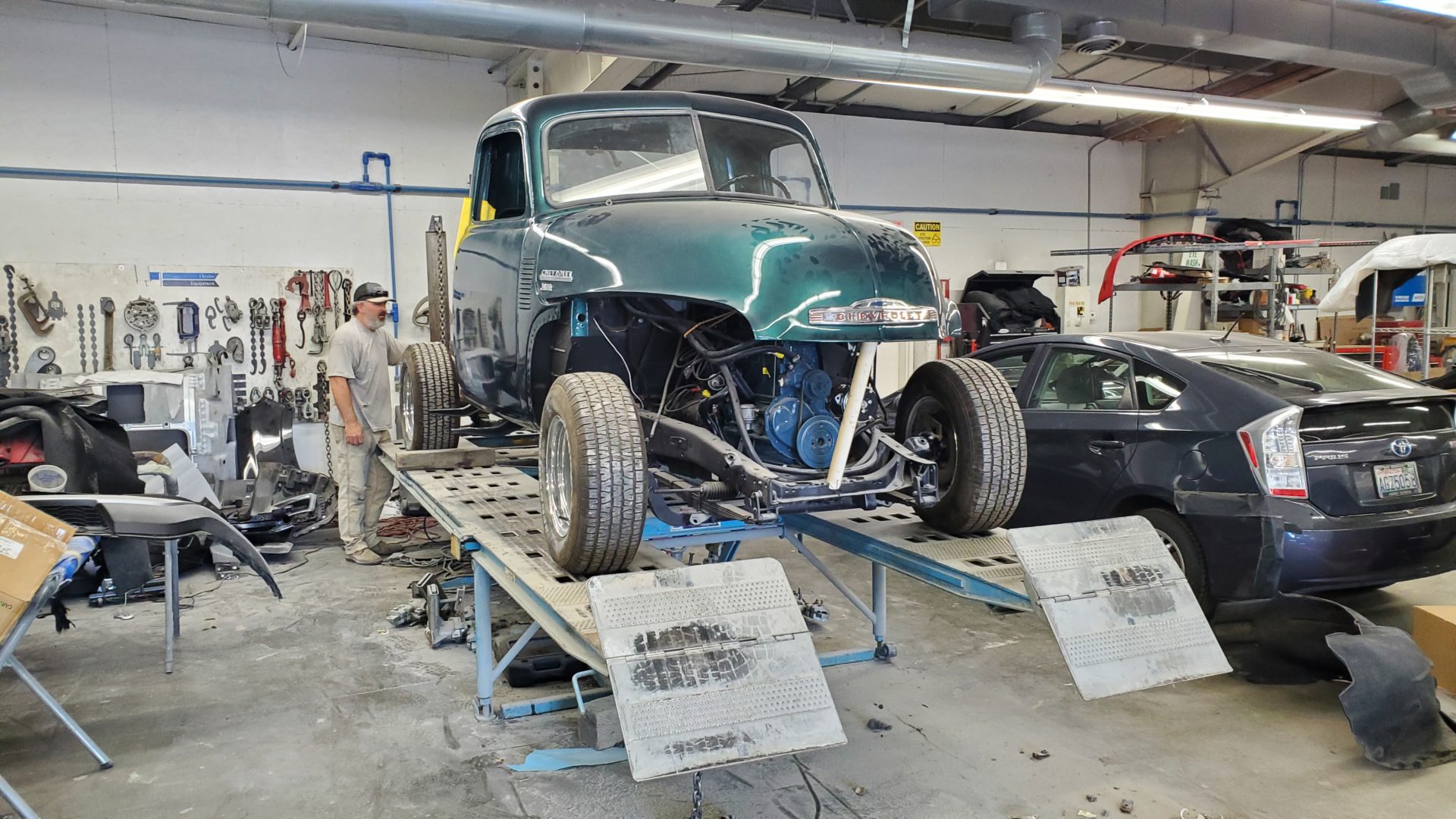 Truck is loaded on the frame straightening rack