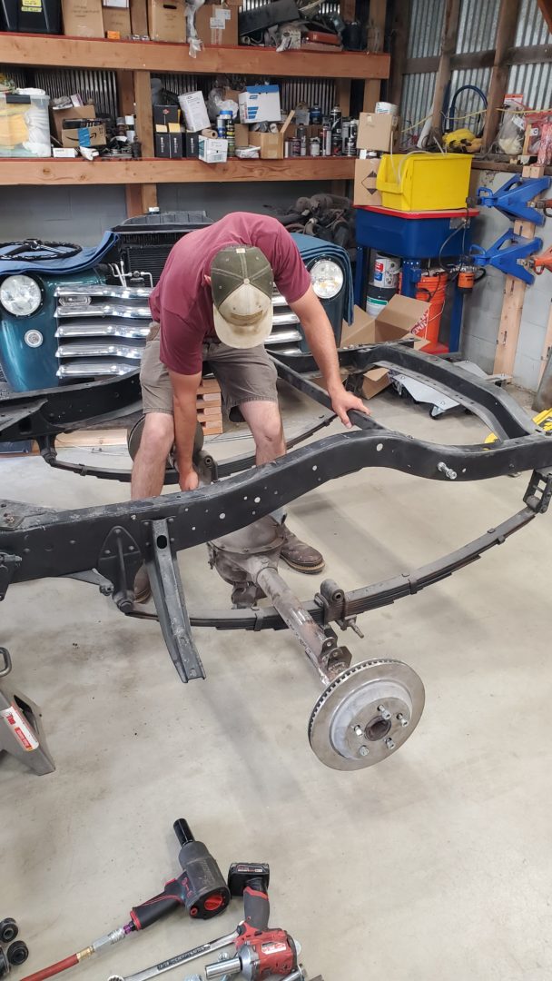 Camaro axle is unbolted and removed