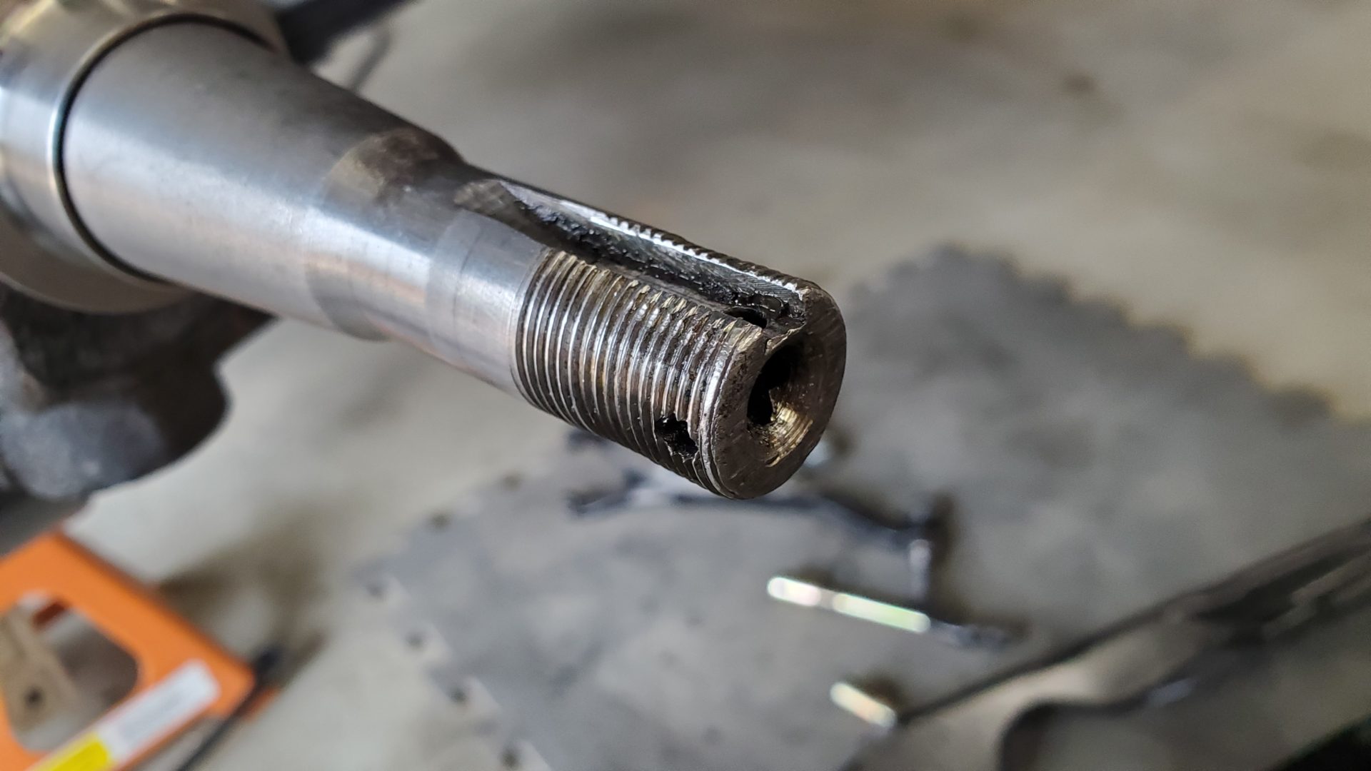 Damaged spindle threads. They’re amost missing in the middle. Luckily the nut lives out near the end.