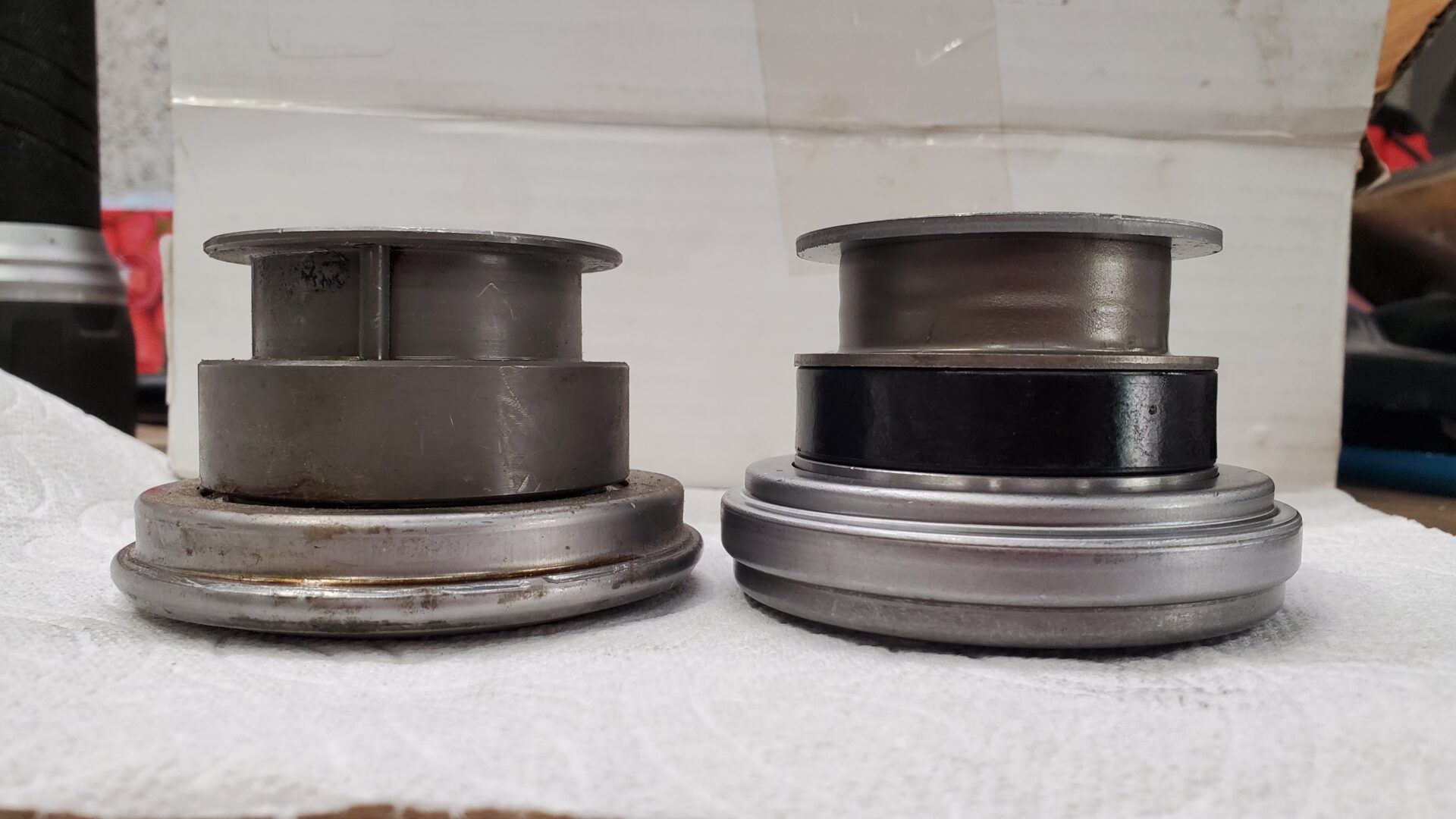 'Old' throwout bearing on the left and new, slightly taller or 'thicker' on the right.