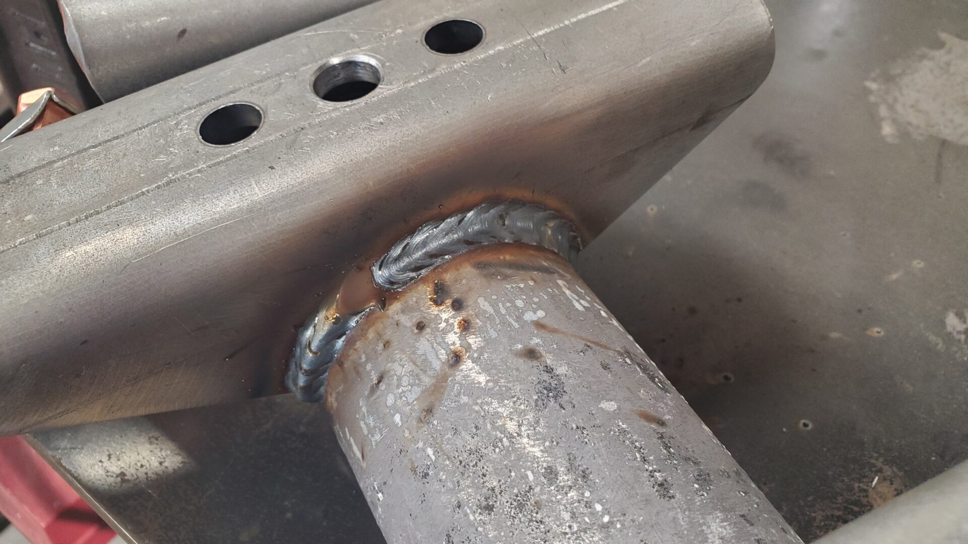 Spring perch welded to axle tube. Nice looking weld!