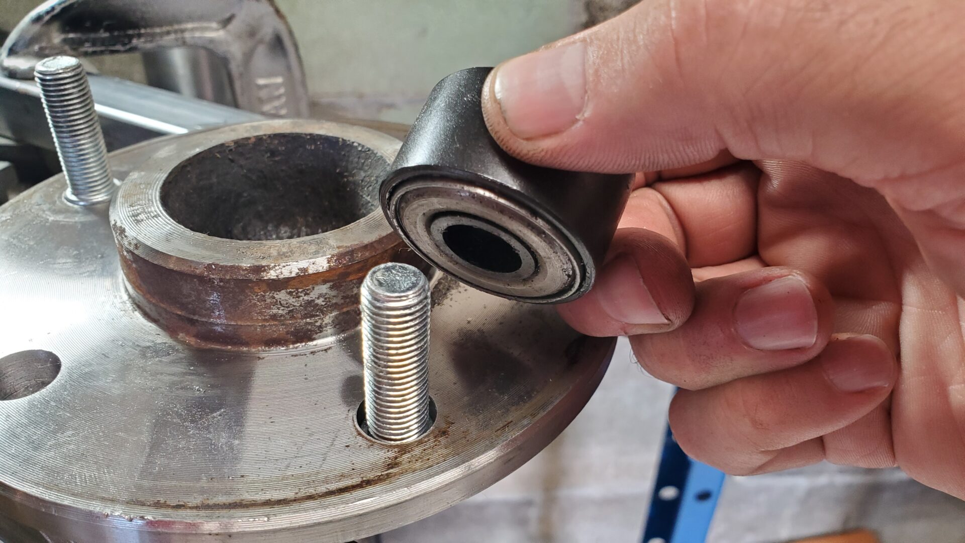 Some guys use a stack of washers with a lug nut to pull the stud into the axle. Here we're using a bearing style tool..