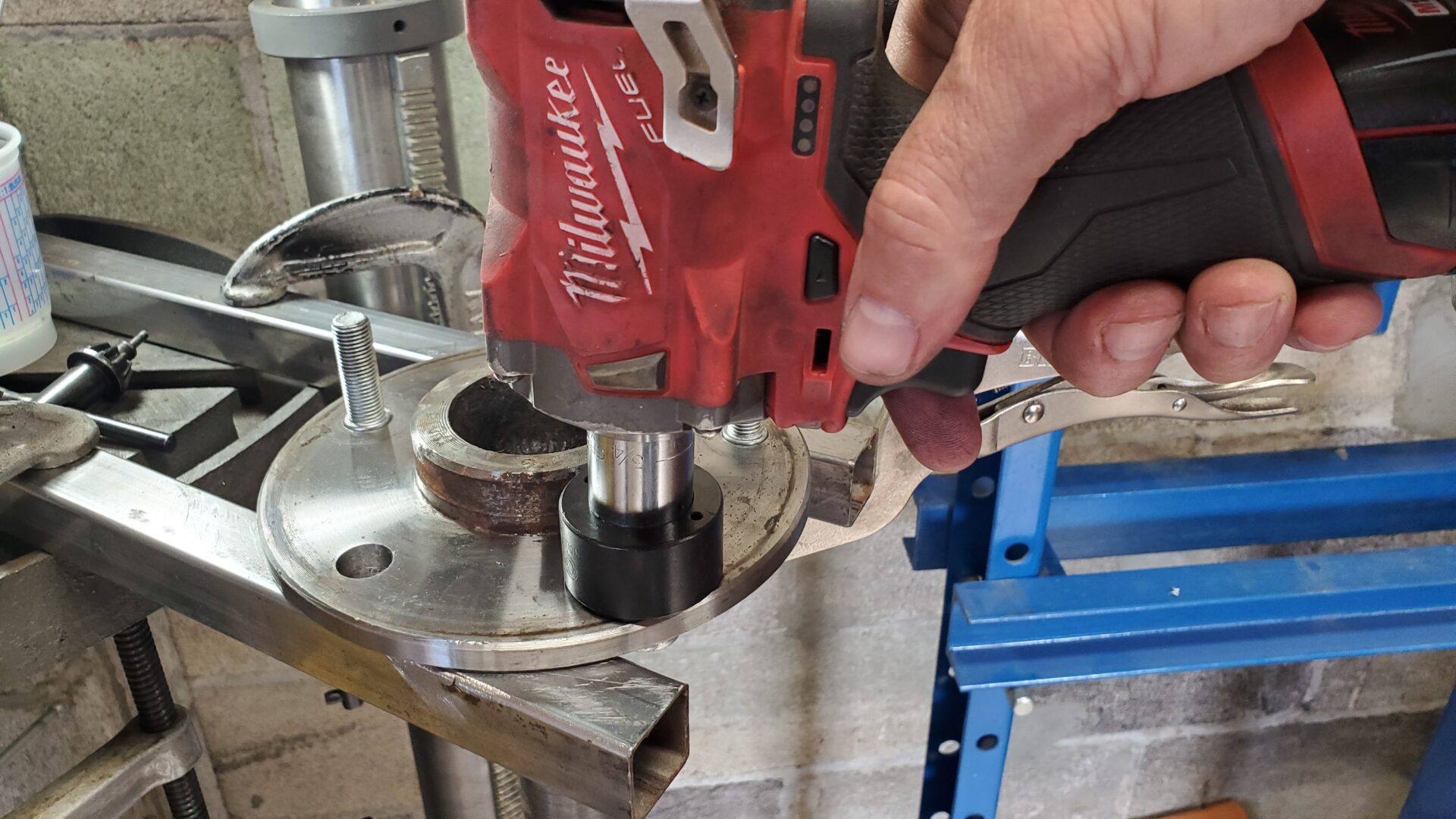 A battery powered impact wrench easily pulls the stud into the axle.