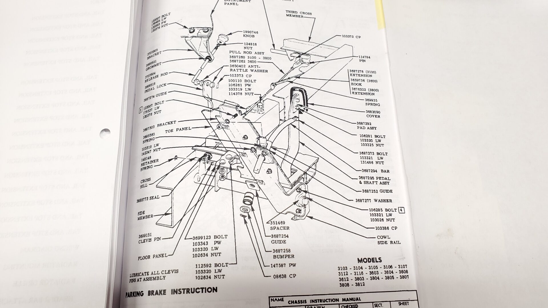 Production drawing for the parking brake helps make sense of what's supposed to be here and where it goes.