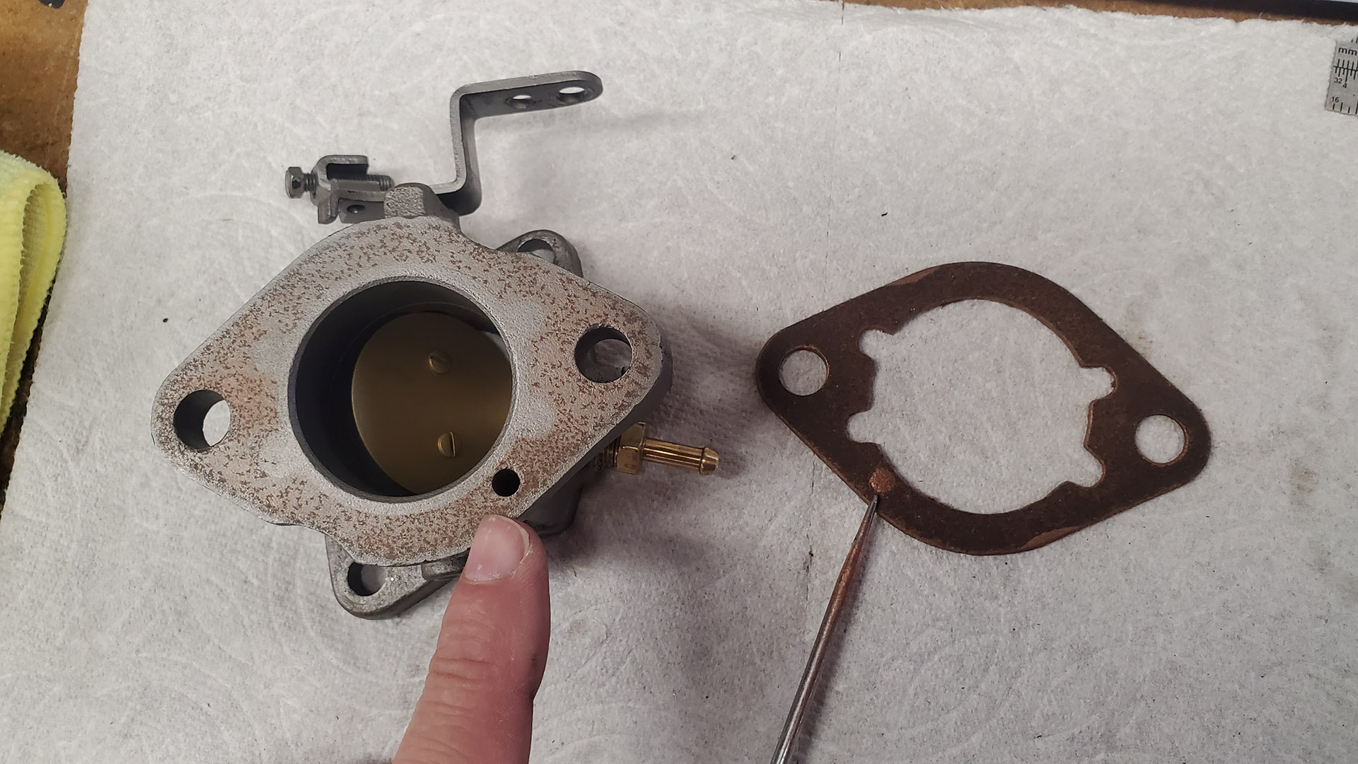 The carburetor to intake gasket (right) was blocking an important vacuum port on both carbs